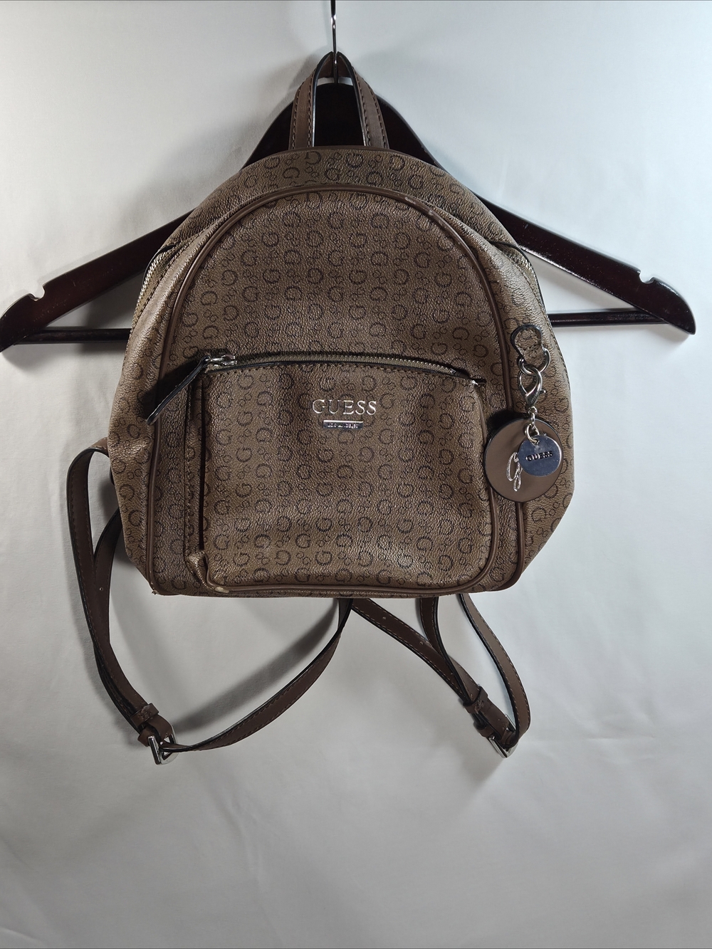 GUESS All Over Logo-Print Tan Mini Backpack with Charm